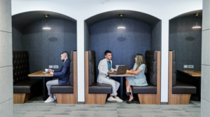 coworking hot desks with coworkers collaborating